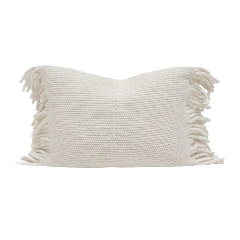 Coussin frangé en laine
