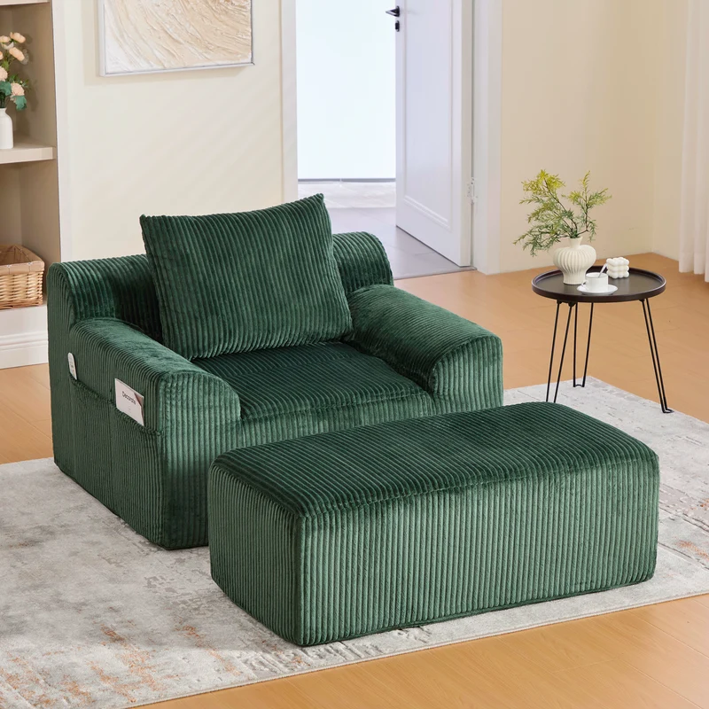 Canapé simple fauteuil XXL en velours côtelé vert, dossier profond, repose pied, coussin & poches latérales, sans montage MILKWEEDFLOSS