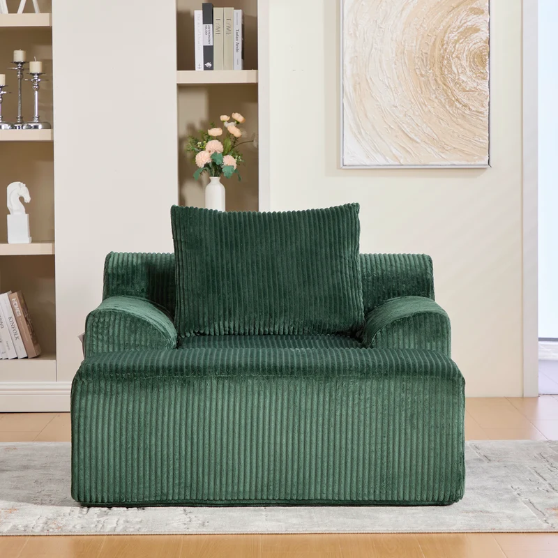 Canapé simple fauteuil XXL en velours côtelé vert, dossier profond, repose pied, coussin & poches latérales, sans montage MILKWEEDFLOSS